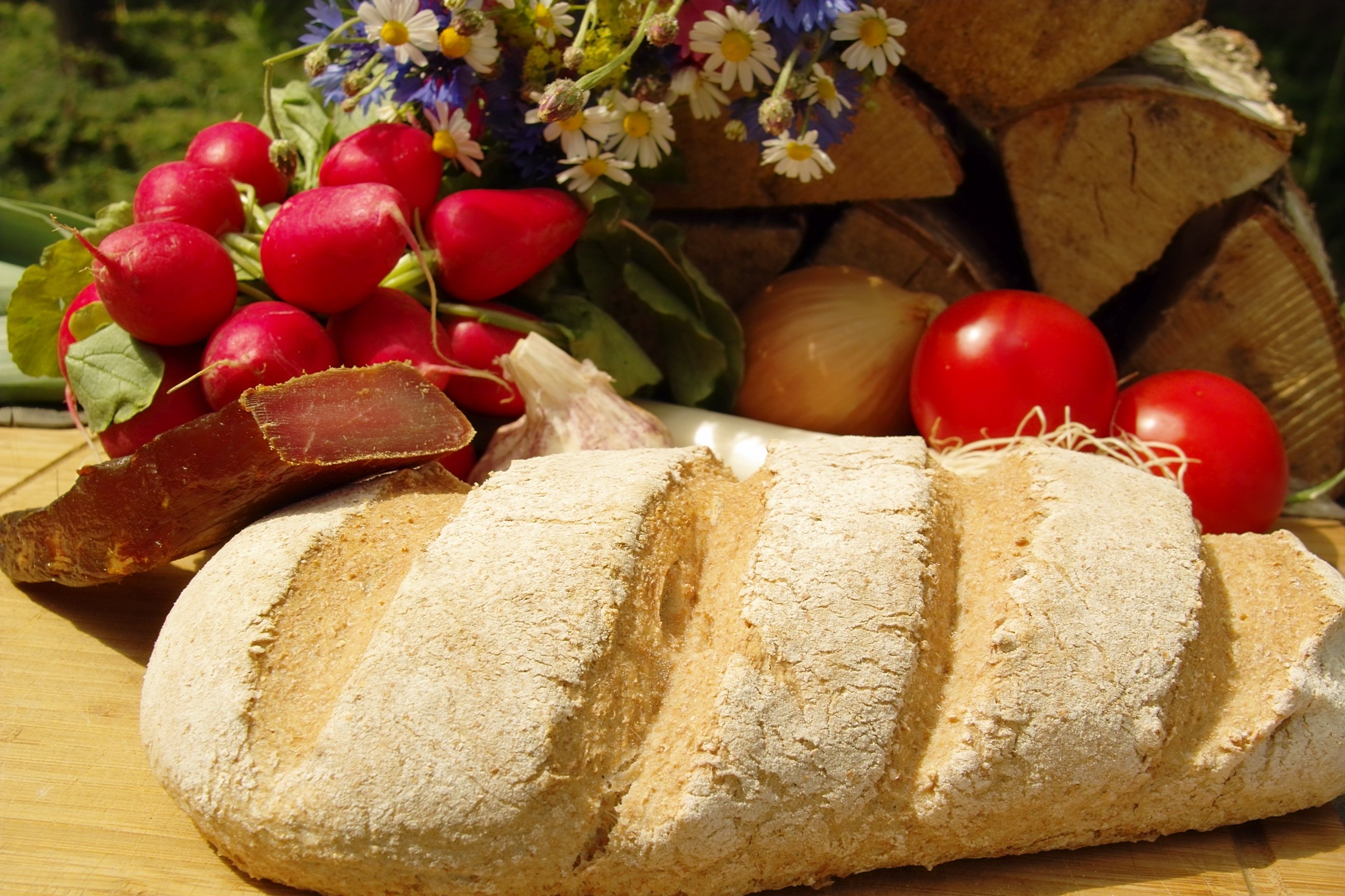 Bread. Хлеб чиабатта черный. Хлеб на столе. Хлеб на столе картинки. Хлеб на деревянном фоне.